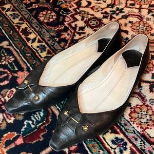 Black leather Chanel flats